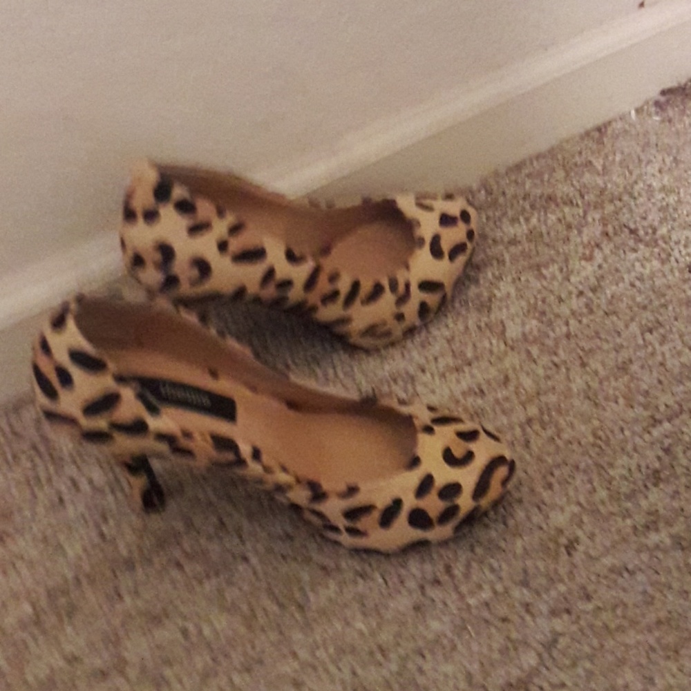 Pair of leopard print hair pumps